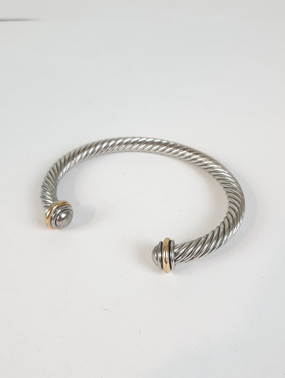 Silver and gold tone twist cuff bracelet